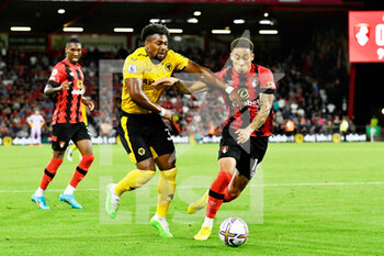 2022-09-01 - Adama Traore (37) of Wolverhampton Wanderers battles for possession with Marcus Tavernier (16) of AFC Bournemouth during the English championship Premier League football match between Bournemouth and Wolverhampton Wanderers on August 31, 2022 at the Vitality Stadium in Bournemouth, England - FOOTBALL - ENGLISH CHAMP - BOURNEMOUTH V WOLVERHAMPTON - ENGLISH PREMIER LEAGUE - SOCCER