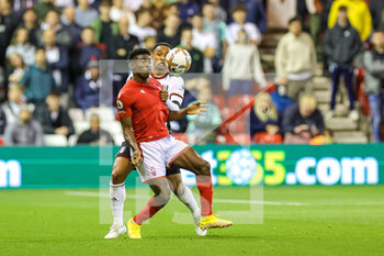 2022-09-16 - Kenny Tete (2) of Fulham tussles with Taiwo Awoniyi (9) of Nottingham Forest during the Premier League match between Nottingham Forest and Fulham at the City Ground, Nottingham, England on 16 September 2022. Photo Nigel Keene / ProSportsImages / DPPI - FOOTBALL - ENGLISH CHAMP - NOTTINGHAM FOREST V FULHAM - ENGLISH PREMIER LEAGUE - SOCCER