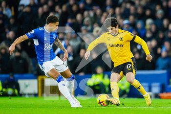 2022-12-26 - Wolves Goncalo Guedes, Everton's Ben Godfrey during the English championship Premier League football match between Everton and Wolverhampton Wanderers on December 26, 2022 at Goodison Park in Liverpool, England - FOOTBALL - ENGLISH CHAMP - EVERTON V WOLVERHAMPTON - ENGLISH PREMIER LEAGUE - SOCCER