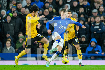2022-12-26 - Everton's Nathan Patterson holds off Wolves Goncalo Guedes during the English championship Premier League football match between Everton and Wolverhampton Wanderers on December 26, 2022 at Goodison Park in Liverpool, England - FOOTBALL - ENGLISH CHAMP - EVERTON V WOLVERHAMPTON - ENGLISH PREMIER LEAGUE - SOCCER