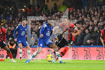 2022-12-27 - Chelsea forward Raheem Sterling under pressure from AFC Bournemouth defender Lloyd Kelly during the English championship Premier League football match between Chelsea and Bournemouth on December 27, 2022 at Stamford Bridge in London, England - FOOTBALL - ENGLISH CHAMP - CHELSEA V BOURNEMOUTH - ENGLISH PREMIER LEAGUE - SOCCER