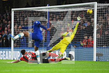 2022-12-27 - AFC Bournemouth goalkeeper Mark Travers makes a save from Chelsea forward Raheem Sterling during the English championship Premier League football match between Chelsea and Bournemouth on December 27, 2022 at Stamford Bridge in London, England - FOOTBALL - ENGLISH CHAMP - CHELSEA V BOURNEMOUTH - ENGLISH PREMIER LEAGUE - SOCCER