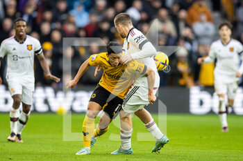 2022-12-31 - Wolverhampton Wanderers forward Hwang Hee-chan (11), Manchester United defender Luke Shaw during the English championship Premier League football match between Wolverhampton Wanderers and Manchester United on 31 December 2022 at Molineux stadium in Wolverhampton, England - FOOTBALL - ENGLISH CHAMP - WOLVERHAMPTON V MANCHESTER UNITED - ENGLISH PREMIER LEAGUE - SOCCER
