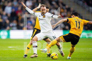 2022-12-31 - Manchester United midfielder Christian Eriksen (14), Hwang Hee-chan of Wolverhampton during the English championship Premier League football match between Wolverhampton Wanderers and Manchester United on 31 December 2022 at Molineux stadium in Wolverhampton, England - FOOTBALL - ENGLISH CHAMP - WOLVERHAMPTON V MANCHESTER UNITED - ENGLISH PREMIER LEAGUE - SOCCER
