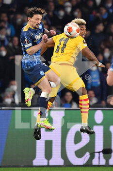 2022-02-24 - Barcelona's forward Adama Traore jump for the ball with Napoli's defender Mario Rui  - SSC NAPOLI VS FC BARCELLONA - UEFA EUROPA LEAGUE - SOCCER