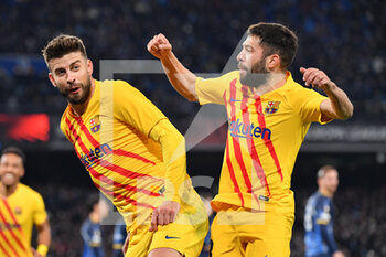 2022-02-24 - Barcelona's defender Gerard Pique celebrates with Barcelona's defender Jordi Alba after scoring the 1-3 goal  - SSC NAPOLI VS FC BARCELLONA - UEFA EUROPA LEAGUE - SOCCER