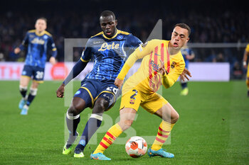 2022-02-24 - Napoli's defender Kalidou Koulibaly and Barcelona's defender Sergino Dest in action  - SSC NAPOLI VS FC BARCELLONA - UEFA EUROPA LEAGUE - SOCCER