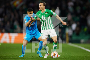 2022-02-24 - Douglas Santos of Zenit and Sergio Canales of Real Betis during the UEFA Europa League, Play-off, 2nd leg football match between Real Betis and Zenit on February 24, 2022 at Ramon Sanchez-Pizjuan stadium in Sevilla, Spain - REAL BETIS VS ZENIT - UEFA EUROPA LEAGUE - SOCCER