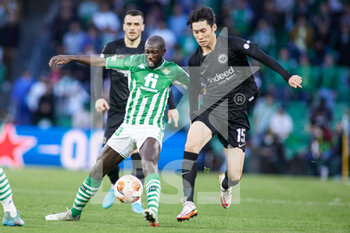 2022-03-09 - Youssouf Sabaly of Real Betis and Daichi Kamada of Eintracht during the UEFA Europa League, Round of 16, 1st leg football match between Real Betis and Eintracht Frankfurt on March 9, 2022 at Benito Villamarin stadium in Sevilla, Spain - REAL BETIS VS EINTRACHT FRANKFURT - UEFA EUROPA LEAGUE - SOCCER