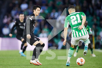 2022-03-09 - Daichi Kamada of Eintracht and Guido Rodriguez of Real Betis during the UEFA Europa League, Round of 16, 1st leg football match between Real Betis and Eintracht Frankfurt on March 9, 2022 at Benito Villamarin stadium in Sevilla, Spain - REAL BETIS VS EINTRACHT FRANKFURT - UEFA EUROPA LEAGUE - SOCCER