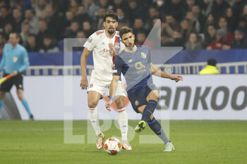 2022-03-17 - Marko GRUJIC of Porto and Lucas PAQUETA of Lyon during the UEFA Europa League, Round of 16, 2nd leg football match between Olympique Lyonnais (Lyon) and FC Porto on March 17, 2022 at Groupama stadium in Decines-Charpieu near Lyon, France - OLYMPIQUE LYONNAIS (LYON, OL) VS FC PORTO - UEFA EUROPA LEAGUE - SOCCER