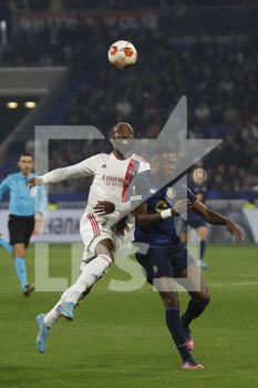2022-03-17 - Moussa DEMBELE of Lyon and Chancel MBEMBA of Porto during the UEFA Europa League, Round of 16, 2nd leg football match between Olympique Lyonnais (Lyon) and FC Porto on March 17, 2022 at Groupama stadium in Decines-Charpieu near Lyon, France - OLYMPIQUE LYONNAIS (LYON, OL) VS FC PORTO - UEFA EUROPA LEAGUE - SOCCER