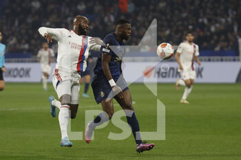2022-03-17 - Chancel MBEMBA of Porto and Moussa DEMBELE of Lyon during the UEFA Europa League, Round of 16, 2nd leg football match between Olympique Lyonnais (Lyon) and FC Porto on March 17, 2022 at Groupama stadium in Decines-Charpieu near Lyon, France - OLYMPIQUE LYONNAIS (LYON, OL) VS FC PORTO - UEFA EUROPA LEAGUE - SOCCER