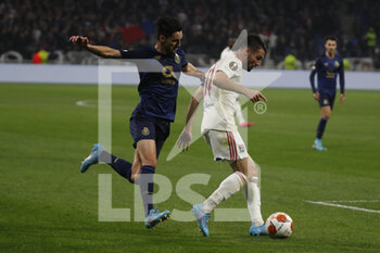 2022-03-17 - Leo DUBOIS of Lyon and Stephen EUSTAQUIO of Porto during the UEFA Europa League, Round of 16, 2nd leg football match between Olympique Lyonnais (Lyon) and FC Porto on March 17, 2022 at Groupama stadium in Decines-Charpieu near Lyon, France - OLYMPIQUE LYONNAIS (LYON, OL) VS FC PORTO - UEFA EUROPA LEAGUE - SOCCER