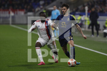 2022-03-17 - Fabio VIEIRA of Porto and Tanguy NDOMBELE of Lyon during the UEFA Europa League, Round of 16, 2nd leg football match between Olympique Lyonnais (Lyon) and FC Porto on March 17, 2022 at Groupama stadium in Decines-Charpieu near Lyon, France - OLYMPIQUE LYONNAIS (LYON, OL) VS FC PORTO - UEFA EUROPA LEAGUE - SOCCER