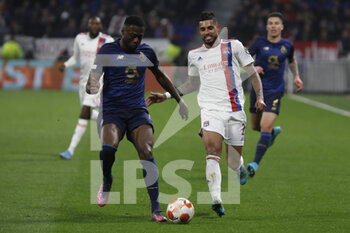 2022-03-17 - EMERSON of Lyon and Chancel MBEMBA of Porto during the UEFA Europa League, Round of 16, 2nd leg football match between Olympique Lyonnais (Lyon) and FC Porto on March 17, 2022 at Groupama stadium in Decines-Charpieu near Lyon, France - OLYMPIQUE LYONNAIS (LYON, OL) VS FC PORTO - UEFA EUROPA LEAGUE - SOCCER