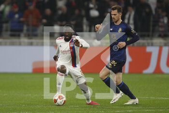 2022-03-17 - Tanguy NDOMBELE of Lyon Toni MARTINEZ of Porto and during the UEFA Europa League, Round of 16, 2nd leg football match between Olympique Lyonnais (Lyon) and FC Porto on March 17, 2022 at Groupama stadium in Decines-Charpieu near Lyon, France - OLYMPIQUE LYONNAIS (LYON, OL) VS FC PORTO - UEFA EUROPA LEAGUE - SOCCER
