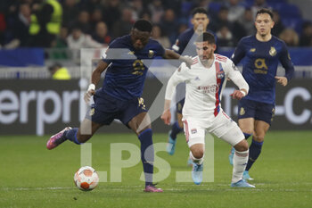 2022-03-17 - Chancel MBEMBA of Porto and Houssem AOUAR of Lyon during the UEFA Europa League, Round of 16, 2nd leg football match between Olympique Lyonnais (Lyon) and FC Porto on March 17, 2022 at Groupama stadium in Decines-Charpieu near Lyon, France - OLYMPIQUE LYONNAIS (LYON, OL) VS FC PORTO - UEFA EUROPA LEAGUE - SOCCER