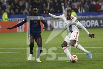 2022-03-17 - Karl TOKO EKAMBI of Lyon and ZAIDU of Porto during the UEFA Europa League, Round of 16, 2nd leg football match between Olympique Lyonnais (Lyon) and FC Porto on March 17, 2022 at Groupama stadium in Decines-Charpieu near Lyon, France - OLYMPIQUE LYONNAIS (LYON, OL) VS FC PORTO - UEFA EUROPA LEAGUE - SOCCER