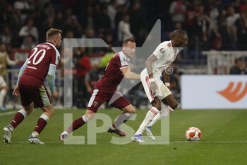 2022-04-14 - Karl TOKO EKAMBI of Lyon and Vladimir COUFAL of West Ham United and Jarrod BOWEN of West Ham United during the UEFA Europa League, Quarter-finals, 2nd leg football match between Olympique Lyonnais (Lyon) and West Ham United on April 14, 2022 at Groupama stadium in Decines-Charpieu near Lyon, France - OLYMPIQUE LYONNAIS (LYON) VS WEST HAM UNITED - UEFA EUROPA LEAGUE - SOCCER