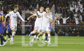 2022-04-14 - Rafael Borre of Frankfurt celebrates his goal 0-2 with Jesper Lindstrom and Kristijan Jakic during the UEFA Europa League, Quarter-finals, 2nd leg football match between FC Barcelona and Eintracht Frankfurt on April 14, 2022 at Camp Nou stadium in Barcelona, Spain - FC BARCELONA VS EINTRACHT FRANKFURT - UEFA EUROPA LEAGUE - SOCCER