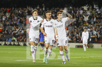 2022-04-14 - Rafael Borre of Frankfurt celebrates his goal 0-2 with Jesper Lindstrom and Kristijan Jakic during the UEFA Europa League, Quarter-finals, 2nd leg football match between FC Barcelona and Eintracht Frankfurt on April 14, 2022 at Camp Nou stadium in Barcelona, Spain - FC BARCELONA VS EINTRACHT FRANKFURT - UEFA EUROPA LEAGUE - SOCCER