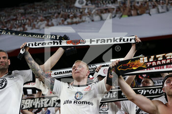 2022-05-18 - Eintracht Frankfurt fans celebrate hold up their scarves - UEFA EUROPA LEAGUE 2022 FINAL - EINTRACHT VS RANGERS - UEFA EUROPA LEAGUE - SOCCER