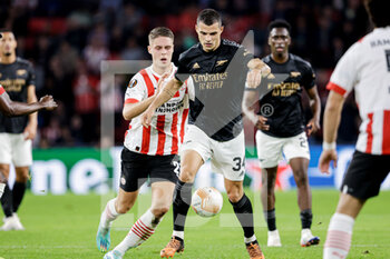 2022-10-27 - Joey Veerman of PSV Eindhoven, Granit Xhaka of Arsenal during the UEFA Europa League, Group A football match between PSV Eindhoven and Arsenal FC on October 27, 2022 at Philips Stadion in Eindhoven, Netherlands - FOOTBALL - EUROPA LEAGUE - PSV V ARSENAL - UEFA EUROPA LEAGUE - SOCCER
