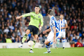 2022-11-03 - Cristiano Ronaldo of Manchester United competes for the ball with Robin Le Normand of Real Sociedad during the UEFA Europa League, Group E football match between Real Sociedad and Manchester United on November 3, 2022 at Reale Arena in San Sebastian, Spain - FOOTBALL - EUROPA LEAGUE - REAL SOCIEDAD V MANCHESTER UNITED - UEFA EUROPA LEAGUE - SOCCER