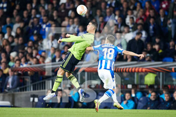 2022-11-03 - Cristiano Ronaldo of Manchester United competes for the ball with Andoni Gorosabel of Real Sociedad during the UEFA Europa League, Group E football match between Real Sociedad and Manchester United on November 3, 2022 at Reale Arena in San Sebastian, Spain - FOOTBALL - EUROPA LEAGUE - REAL SOCIEDAD V MANCHESTER UNITED - UEFA EUROPA LEAGUE - SOCCER