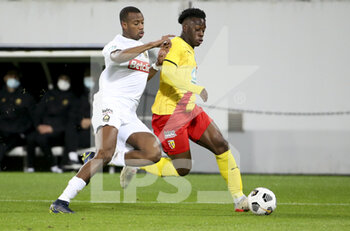 2022-01-04 - Arnaud Kalimuendo of Lens, Tiago Djalo of Lille (left) during the French Cup, round of 32, football match between RC Lens (RCL) and Lille OSC (LOSC) on January 4, 2022 at Stade Bollaert-Delelis in Lens, France - RC LENS (RCL) VS LILLE OSC (LOSC) - FRENCH CUP - SOCCER