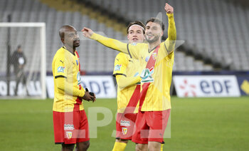 2022-01-04 - From left Gael Kakuta, Patrick Berg, Jonathan Clauss of Lens celebrate the victory after the penalty shoot-out during the French Cup, round of 32, football match between RC Lens (RCL) and Lille OSC (LOSC) on January 4, 2022 at Stade Bollaert-Delelis in Lens, France - RC LENS (RCL) VS LILLE OSC (LOSC) - FRENCH CUP - SOCCER