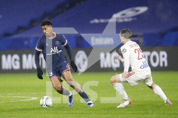 09/01/2022 - Presnel Kimpembe of Paris and Maxence Caqueret of Lyon during the French championship Ligue 1 football match between Olympique Lyonnais (Lyon) and Paris Saint-Germain on January 9, 2022 at Groupama stadium in Decines-Charpieu near Lyon, France - OLYMPIQUE LYONNAIS (LYON) VS PARIS SAINT-GERMAIN - FRENCH LIGUE 1 - CALCIO