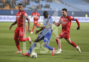 16/01/2022 - Abdu Conte of Troyes between Jerome Boateng and Leo Dubois of Lyon during the French championship Ligue 1 football match between ESTAC Troyes and Olympique Lyonnais (Lyon) on January 16, 2022 at Stade de L'Aube in Troyes, France - ESTAC TROYES VS OLYMPIQUE LYONNAIS (LYON) - FRENCH LIGUE 1 - CALCIO
