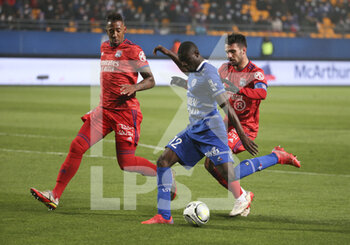 16/01/2022 - Abdu Conte of Troyes between Jerome Boateng and Leo Dubois of Lyon during the French championship Ligue 1 football match between ESTAC Troyes and Olympique Lyonnais (Lyon) on January 16, 2022 at Stade de L'Aube in Troyes, France - ESTAC TROYES VS OLYMPIQUE LYONNAIS (LYON) - FRENCH LIGUE 1 - CALCIO