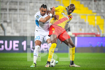 2022-01-22 - Dimitri PAYET of Marseille and Seko FOFANA of Lens during the French championship Ligue 1 football match between RC Lens and Olympique de Marseille on January 22, 2022 at Bollaert-Delelis stadium in Lens, France - RC LENS VS OLYMPIQUE DE MARSEILLE - FRENCH LIGUE 1 - SOCCER