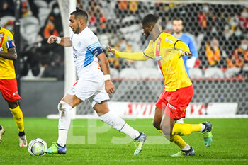2022-01-22 - Dimitri PAYET of Marseille and Kevin DANSO of Lens during the French championship Ligue 1 football match between RC Lens and Olympique de Marseille on January 22, 2022 at Bollaert-Delelis stadium in Lens, France - RC LENS VS OLYMPIQUE DE MARSEILLE - FRENCH LIGUE 1 - SOCCER