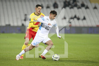 2022-01-22 - Cengiz Under of Marseille, Florian Sotoca of Lens (left) during the French championship Ligue 1 football match between RC Lens (RCL) and Olympique de Marseille (OM) on January 22, 2022 at Stade Bollaert-Delelis in Lens, France - RC LENS VS OLYMPIQUE DE MARSEILLE - FRENCH LIGUE 1 - SOCCER