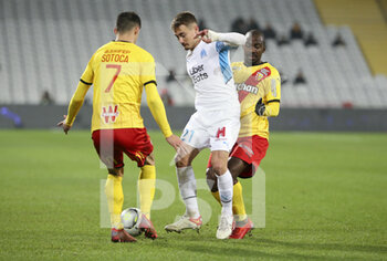 2022-01-22 - Valentin Rongier of Marseille, Gael Kakuta of Lens during the French championship Ligue 1 football match between RC Lens (RCL) and Olympique de Marseille (OM) on January 22, 2022 at Stade Bollaert-Delelis in Lens, France - RC LENS VS OLYMPIQUE DE MARSEILLE - FRENCH LIGUE 1 - SOCCER