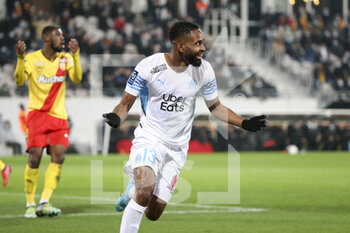 2022-01-22 - Cedric Bakambu of Marseille celebrates his goal while Kevin Danso of Lens (left) reacts during the French championship Ligue 1 football match between RC Lens (RCL) and Olympique de Marseille (OM) on January 22, 2022 at Stade Bollaert-Delelis in Lens, France - RC LENS VS OLYMPIQUE DE MARSEILLE - FRENCH LIGUE 1 - SOCCER