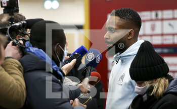 2022-01-22 - Cedric Bakambu of Marseille answers to the media during the post-match press conference following the French championship Ligue 1 football match between RC Lens (RCL) and Olympique de Marseille (OM) on January 22, 2022 at Stade Bollaert-Delelis in Lens, France - RC LENS VS OLYMPIQUE DE MARSEILLE - FRENCH LIGUE 1 - SOCCER