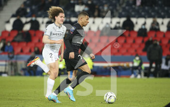 23/01/2022 - Kylian Mbappe of PSG, Wout Faes of Reims (left) during the French championship Ligue 1 football match between Paris Saint-Germain and Stade de Reims on January 23, 2022 at Parc des Princes stadium in Paris, France - PARIS SAINT-GERMAIN VS STADE DE REIMS - FRENCH LIGUE 1 - CALCIO