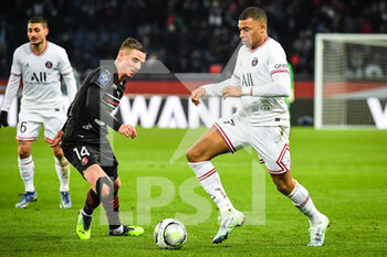 2022-02-11 - Benjamin BOURIGEAUD of Rennes and Kylian MBAPPE of PSG during the French championship Ligue 1 football match between Paris Saint-Germain and Stade Rennais (Rennes) on February 11, 2022 at Parc des Princes stadium in Paris, France - PARIS SAINT-GERMAIN VS STADE RENNAIS (RENNES) - FRENCH LIGUE 1 - SOCCER