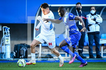 2022-02-27 - Cengiz UNDER of Marseille and Levi Jeremiah LUMEKA of ESTAC Troyes during the French championship Ligue 1 football match between ESTAC Troyes and Olympique de Marseille on February 27, 2022 at Stade de l'Aube in Troyes, France - ESTAC TROYES VS OLYMPIQUE DE MARSEILLE - FRENCH LIGUE 1 - SOCCER