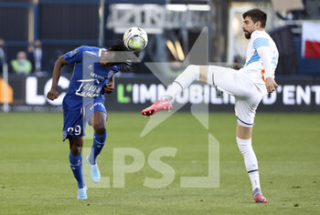 2022-02-27 - Issa Kabore of Troyes, Luan Peres of Marseille during the French championship Ligue 1 football match between ESTAC Troyes and Olympique de Marseille (OM) on February 27, 2022 at Stade de l'Aube in Troyes, France - ESTAC TROYES VS OLYMPIQUE DE MARSEILLE - FRENCH LIGUE 1 - SOCCER