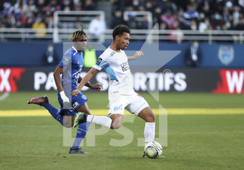 2022-02-27 - Boubacar Kamara of Marseille, Rominigue Kouame of Troyes (left) during the French championship Ligue 1 football match between ESTAC Troyes and Olympique de Marseille (OM) on February 27, 2022 at Stade de l'Aube in Troyes, France - ESTAC TROYES VS OLYMPIQUE DE MARSEILLE - FRENCH LIGUE 1 - SOCCER