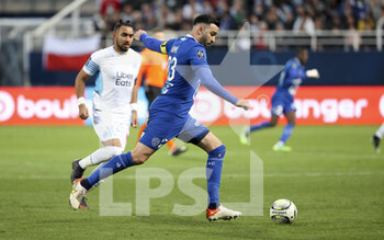28/02/2022 - Adil Rami of Troyes, Dimitri Payet of Marseille (left) during the French championship Ligue 1 football match between ESTAC Troyes and Olympique de Marseille (OM) on February 27, 2022 at Stade de l'Aube in Troyes, France - ESTAC TROYES VS OLYMPIQUE DE MARSEILLE (OM) - FRENCH LIGUE 1 - CALCIO