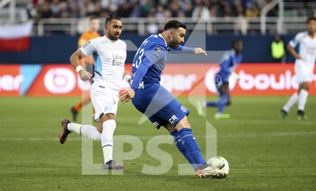 28/02/2022 - Adil Rami of Troyes, Dimitri Payet of Marseille (left) during the French championship Ligue 1 football match between ESTAC Troyes and Olympique de Marseille (OM) on February 27, 2022 at Stade de l'Aube in Troyes, France - ESTAC TROYES VS OLYMPIQUE DE MARSEILLE (OM) - FRENCH LIGUE 1 - CALCIO