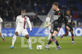27/02/2022 - Sven BOTMAN of Lille and Moussa DEMBELE of Lyon during the French championship Ligue 1 football match between Olympique Lyonnais (Lyon) and LOSC Lille on February 27, 2022 at Groupama stadium in Decines-Charpieu near Lyon, France - OLYMPIQUE LYONNAIS (LYON) VS LOSC LILLE - FRENCH LIGUE 1 - CALCIO