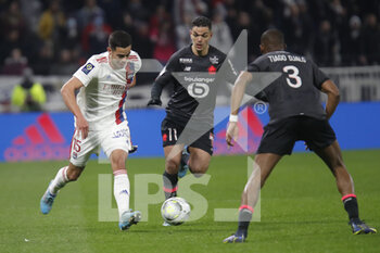 27/02/2022 - Romain FAIVRE of Lyon and Hatem BEN ARFA of Lille and Tiago EMBALO DJALO of Lille during the French championship Ligue 1 football match between Olympique Lyonnais (Lyon) and LOSC Lille on February 27, 2022 at Groupama stadium in Decines-Charpieu near Lyon, France - OLYMPIQUE LYONNAIS (LYON) VS LOSC LILLE - FRENCH LIGUE 1 - CALCIO